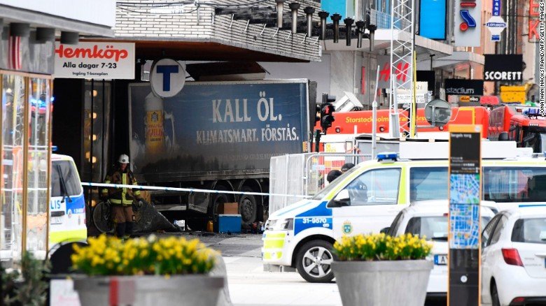 Emergency services work at the scene where a truck drove into pedestrians on a Stockholm, Sweden, street and then crashed into a building on Friday, April 7.