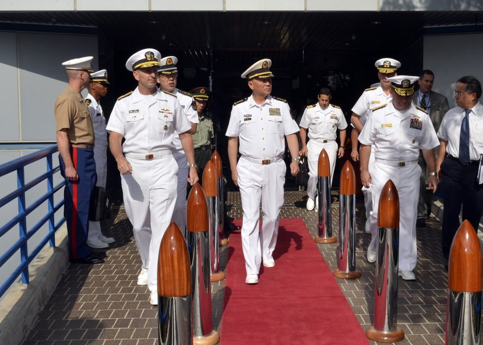 Adm. Jonathan Greenert, left, chief of naval operations, walks with Commander in Chief of the People's Liberation Army Navy Adm. Wu Shengli following a briefing on a future military exercises.
