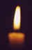 Photo: of a lit candle.