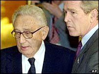 Henry Kissinger (L) and George W Bush