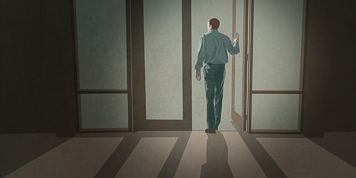 A man walks out of a Kingdom Hall