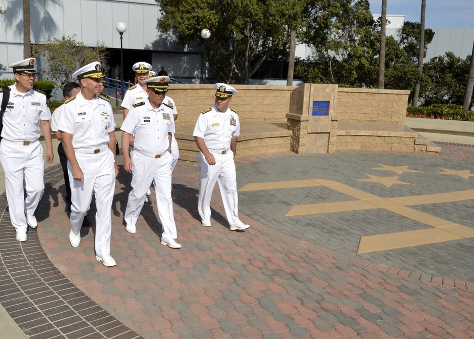 Adm. Jonathan Greenert, the chief of naval operations, walks with Adm. Wu Shengli, commander in chief of the People's Liberation Army Navy, following a briefing for future Rim of the Pacific exercises at 3rd Fleet Headquarters in San Diego.