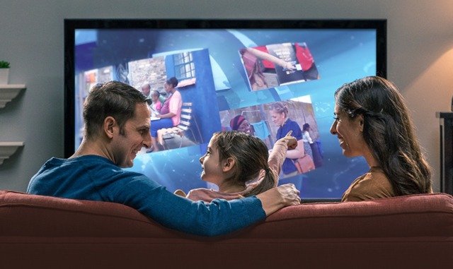 A family watching JW Broadcasting