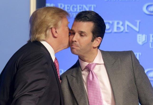 U.S. Republican presidential candidate Donald Trump kisses his son Donald, Jr. at a campaign event at Regents University in Virginia Beach, Virginia February 24, 2016. REUTERS/Joshua Roberts