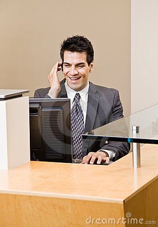 http://thumbs.dreamstime.com/x/male-receptionist-talking-telephone-earpiece-6603797.jpg