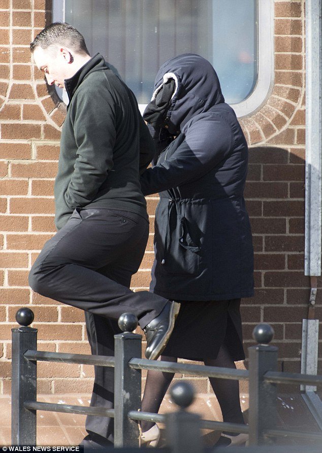 Richards was pictured with a hood covering her head arriving at Merthyr Tydfil Crown Court this morning 